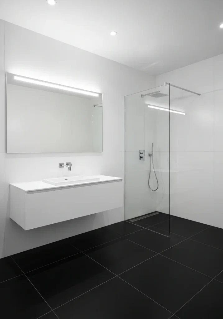 black floor white wall bathroom creating grounded modern contrast