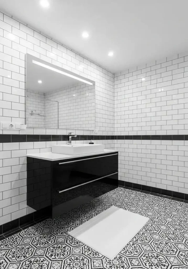 Black and white bathroom design with bold contrast and patterned floor